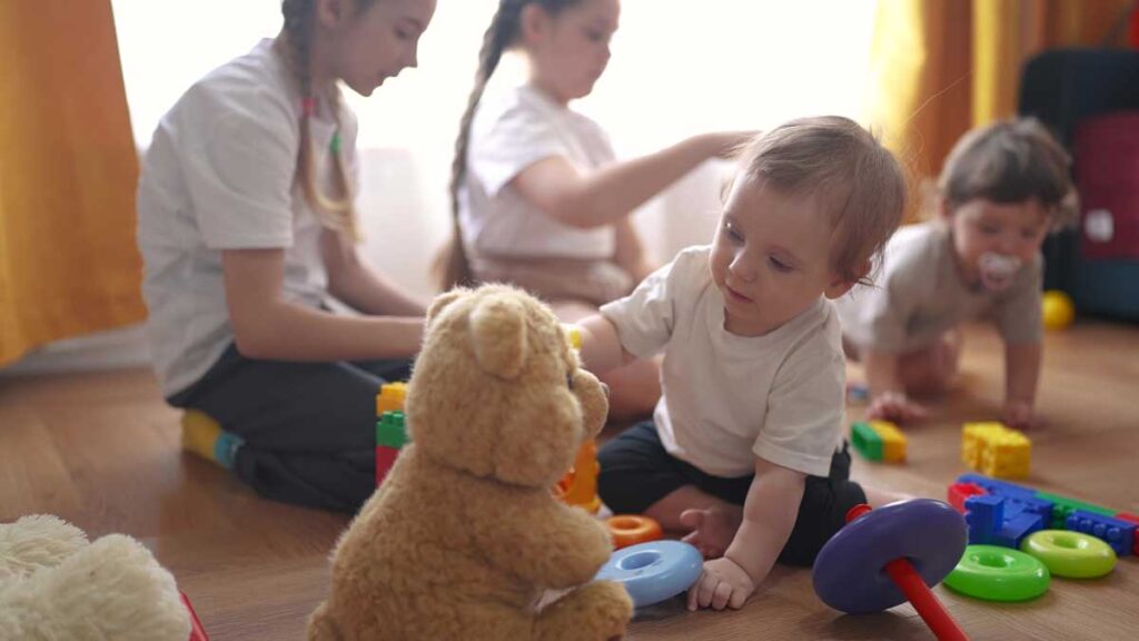 Back-up childcare aids retention. Photo shows children playing.