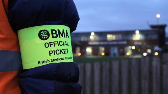 NHS pay disputes - who could strike again? Photo show the arm band of a striking BMA member