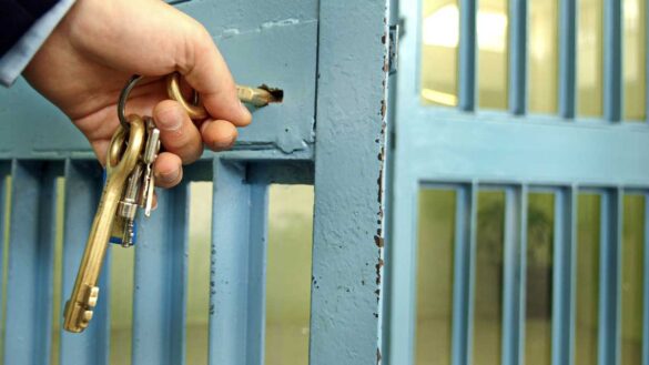 Reasonable adjustments epilepsy: photo shows a key in a lock in a prison