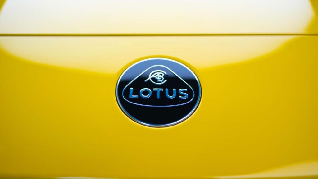Lotus job cuts: Photo shows Lotus badge on a bright yellow sports car.