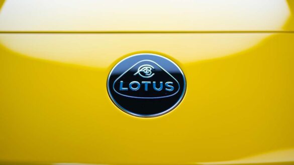 Lotus job cuts: Photo shows Lotus badge on a bright yellow sports car.