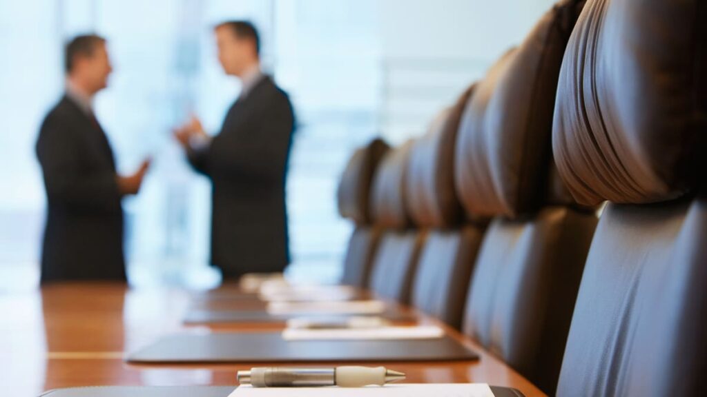 Boardroom - two men discussing