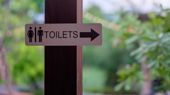 Single-sex space policies: Photo shows a sign to male and female toilets.