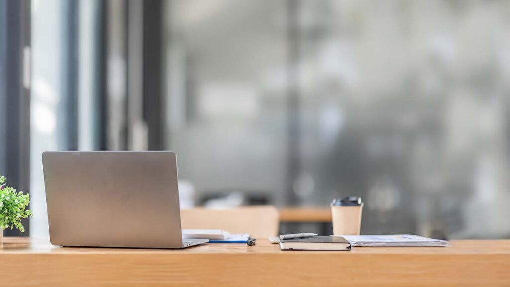 Unauthorised absence. Image shows an empty seat at a desk.