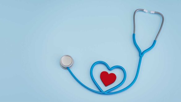 Use of health benefits. Image shows stethoscope with a heart inside a loop.